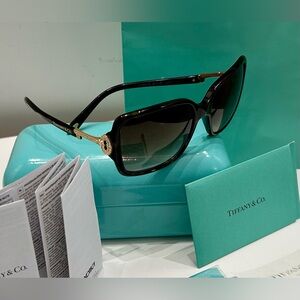 Tiffany Sunglasses 🥂 Excellent pre owned condition. Iconic jeweled key detail.